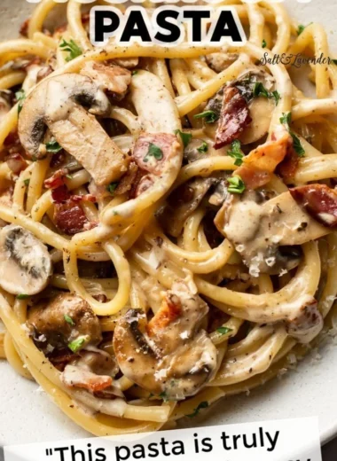 Delicious bacon and mushroom pasta served in a bowl with fresh herbs