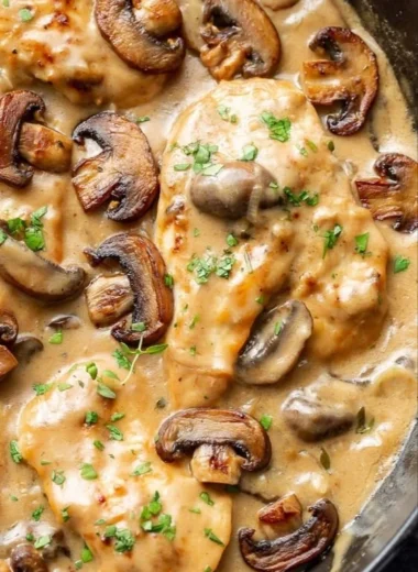 Chicken and Mushrooms Skillet dish served in a frying pan with herbs