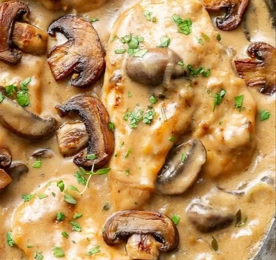 Chicken and Mushrooms Skillet dish served in a frying pan with herbs