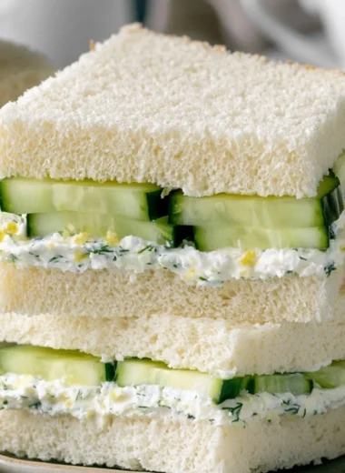 Plate of easy cucumber sandwiches ready to serve at a tea party