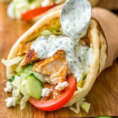 Delicious homemade chicken gyro served with fresh vegetables and sauce