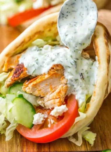 Delicious homemade chicken gyro served with fresh vegetables and sauce