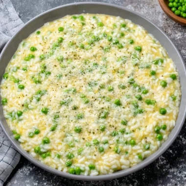 Bowl of traditional Rice and Peas garnished with fresh herbs