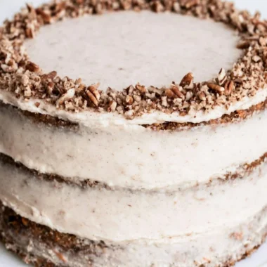 Delicious slice of brown butter carrot cake topped with cream cheese frosting