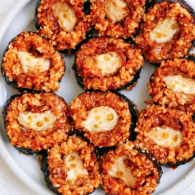 Delicious Cheese Kimchi Kimbap ready to be enjoyed, showcasing Korean culinary fusion.
