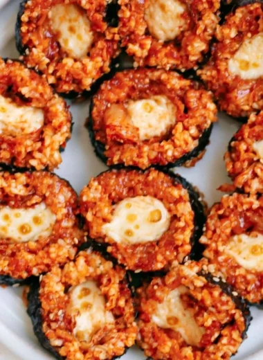 Delicious Cheese Kimchi Kimbap ready to be enjoyed, showcasing Korean culinary fusion.