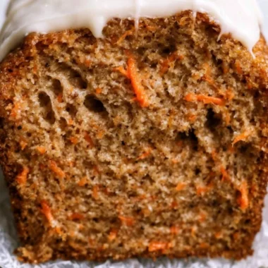 Cozy carrot cake loaf with cream cheese frosting and walnuts