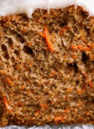 Cozy carrot cake loaf with cream cheese frosting and walnuts