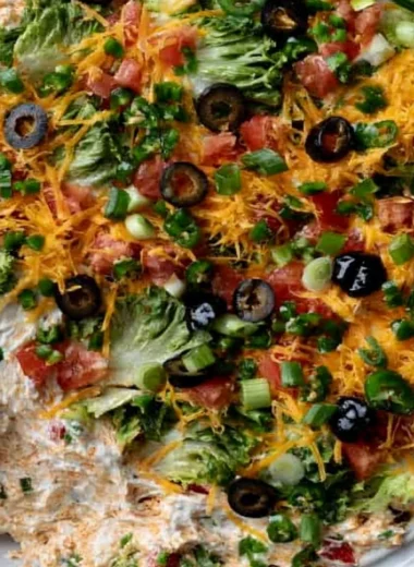 Cozy cottage cheese taco dip served in a bowl with tortilla chips