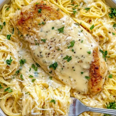 Cozy Crock Pot Angel Chicken dish served with creamy sauce and rice.