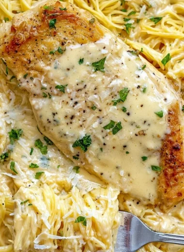 Cozy Crock Pot Angel Chicken dish served with creamy sauce and rice.