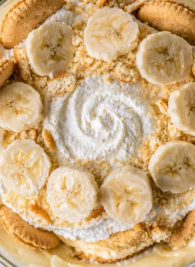 Creamy homemade banana pudding topped with whipped cream and banana slices