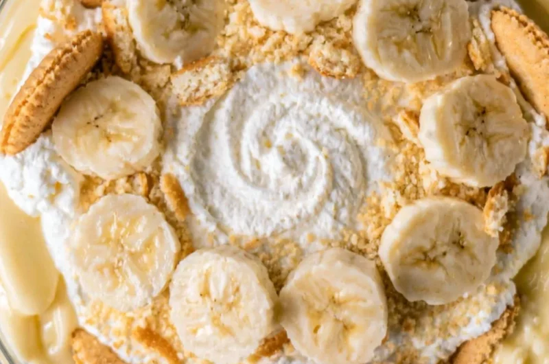Creamy homemade banana pudding topped with whipped cream and banana slices