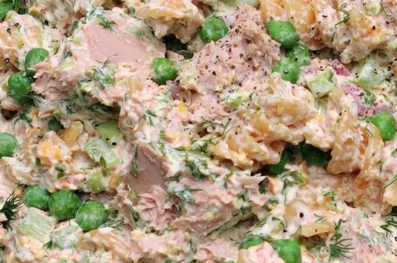 Cozy tuna pasta salad bowl with fresh ingredients and herbs