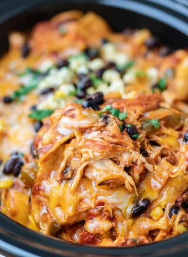 Crockpot Chicken Enchiladas served with toppings in a bowl