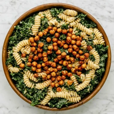 Delicious Kale Caesar Pasta Salad served in a bowl with fresh toppings.