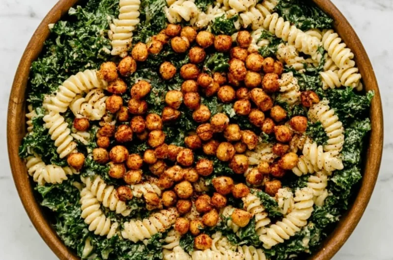Delicious Kale Caesar Pasta Salad served in a bowl with fresh toppings.