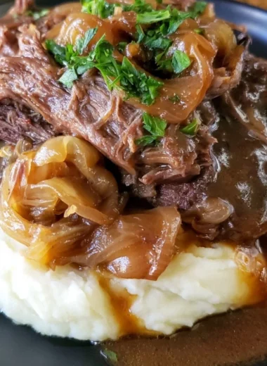 Delicious melt in your mouth pot roast served with vegetables