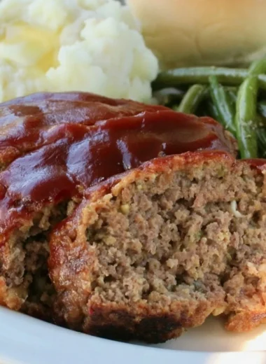 Juicy old fashioned meatloaf served with mashed potatoes and gravy