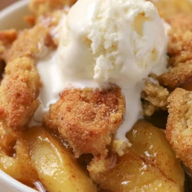 Delicious homemade apple cobbler with a golden crust and juicy apple filling.