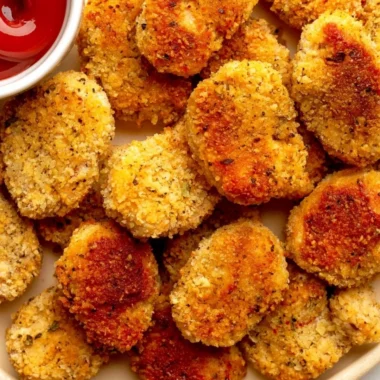 Bowl of cozy healthy chicken nuggets served with dipping sauce