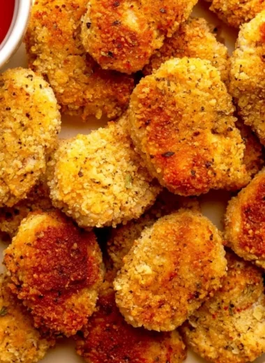 Bowl of cozy healthy chicken nuggets served with dipping sauce