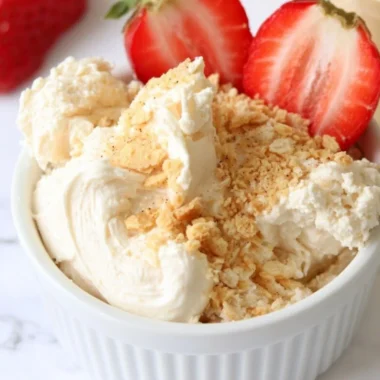 High protein cheesecake dip served in a bowl with dipping options