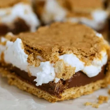 Deliciously baked S'mores Bars with chocolate, marshmallows, and graham crackers.