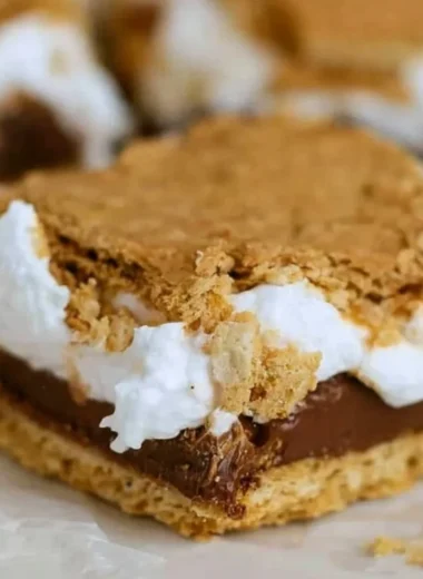Deliciously baked S'mores Bars with chocolate, marshmallows, and graham crackers.