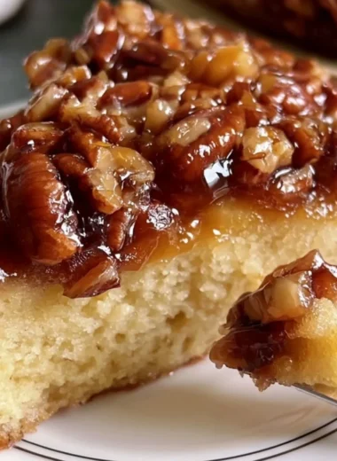 Upside Down Caramel Pecan Cake with pecans and caramel drizzle
